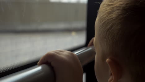 boy in bus coming out the tunnel