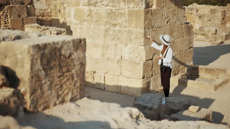 woman exploring ancient ruins