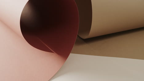 close up of two shades of brown rolled papers on white background with copy space in slow motion