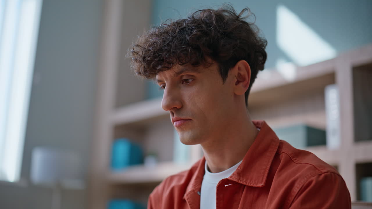 Manager hands writing notes in notebook working at laptop in office closeup