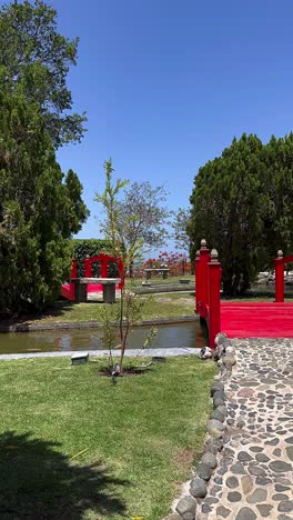 beautiful japanese garden with red bridge