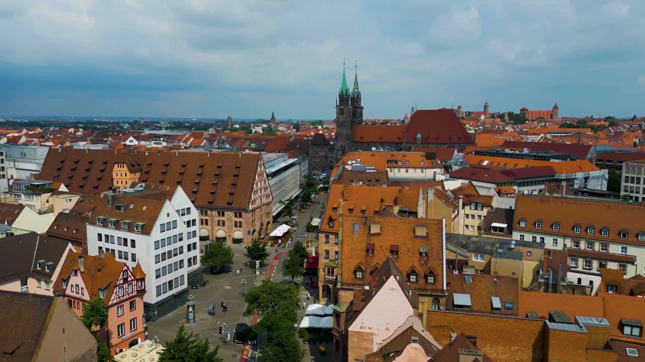 4K Aerial Drone Video of Copper-clad Spiers and Tiled Roof of St. Lawrence Church in Downtown Nurnberg, Germany