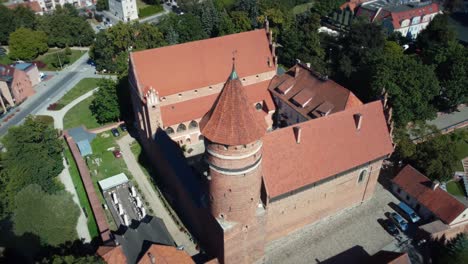 slow drone shot of a gothic castle in eastern europe poland, aerial footage