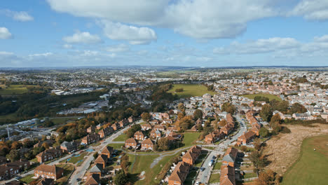 Aerial-View-of-a-typical-UK-town,-suburb-district-sowing-housing,-gardens-and-roads