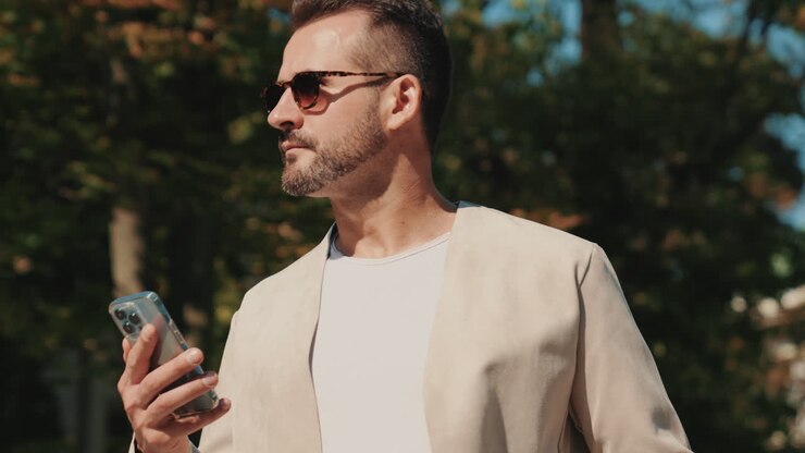 Man using smartphone outdoors