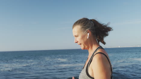 Senior-woman-running-on-a-promenade