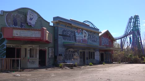 a roller coaster at an abandoned amusement park presents a spooky and haunted image 1