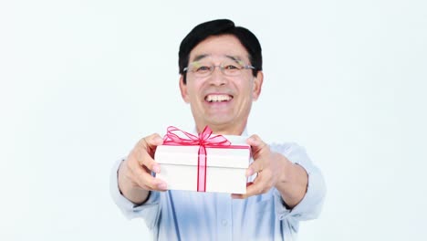 Middle-aged-Asian-man-holding-a-present