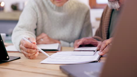 old couple with bills, calculator