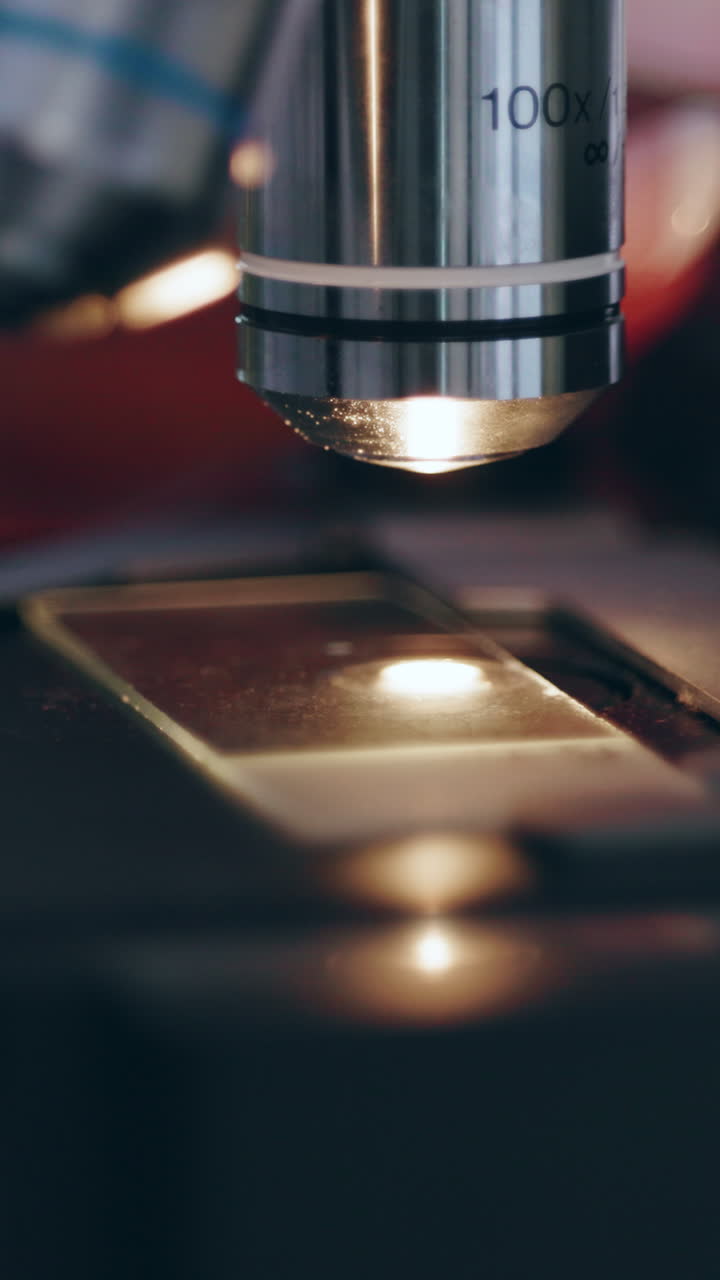 Close-up of a microscope examining a slide