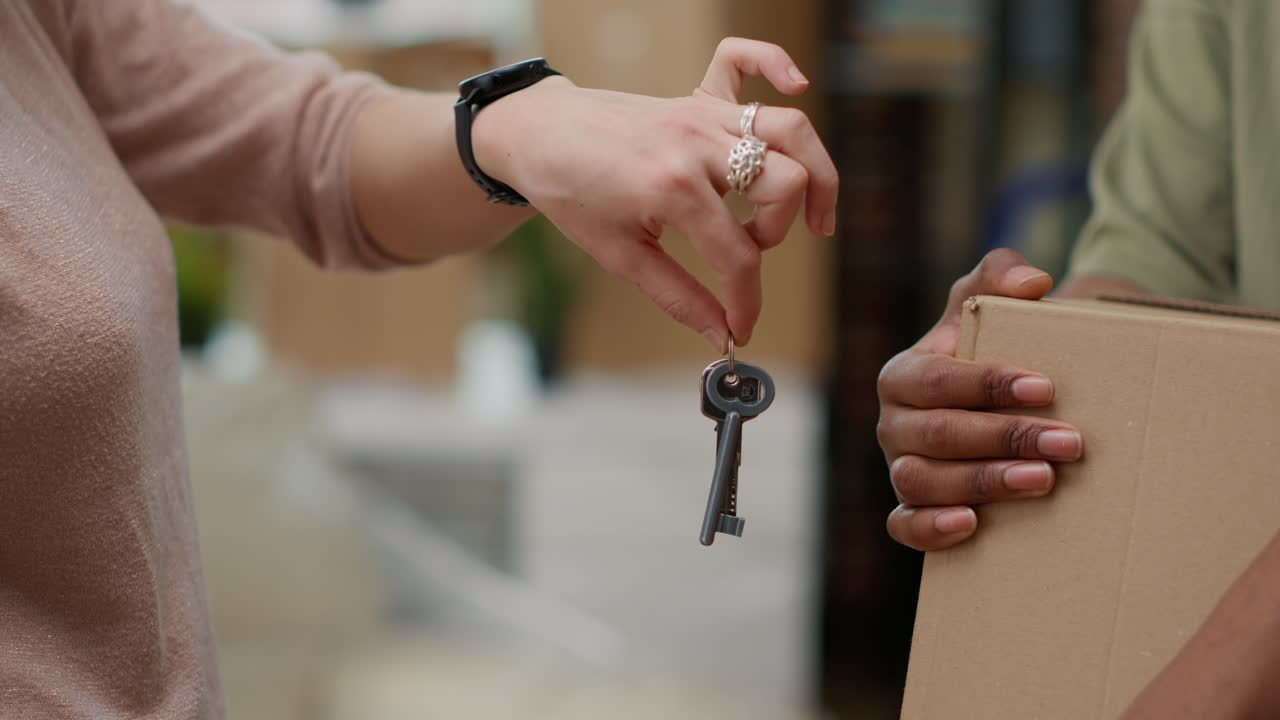 Married couple buying first home and having house keys