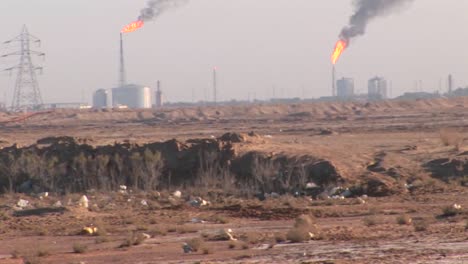 burning extraction wells in an oil or natural gas field in iran  1