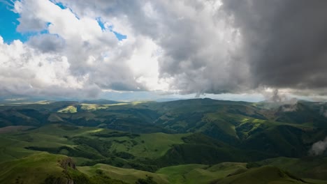 low clouds over a highland plateau in the rays of sunset. sunset on bermamyt plateau north caucasus, karachay-cherkessia, russia.