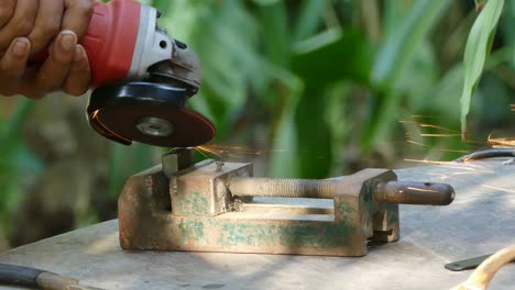 worker grinding metal construction