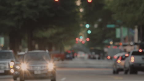 Blurry-background-of-a-traffic-city-street-in-california-during-night,-afternoon-still-shot-of-city-life