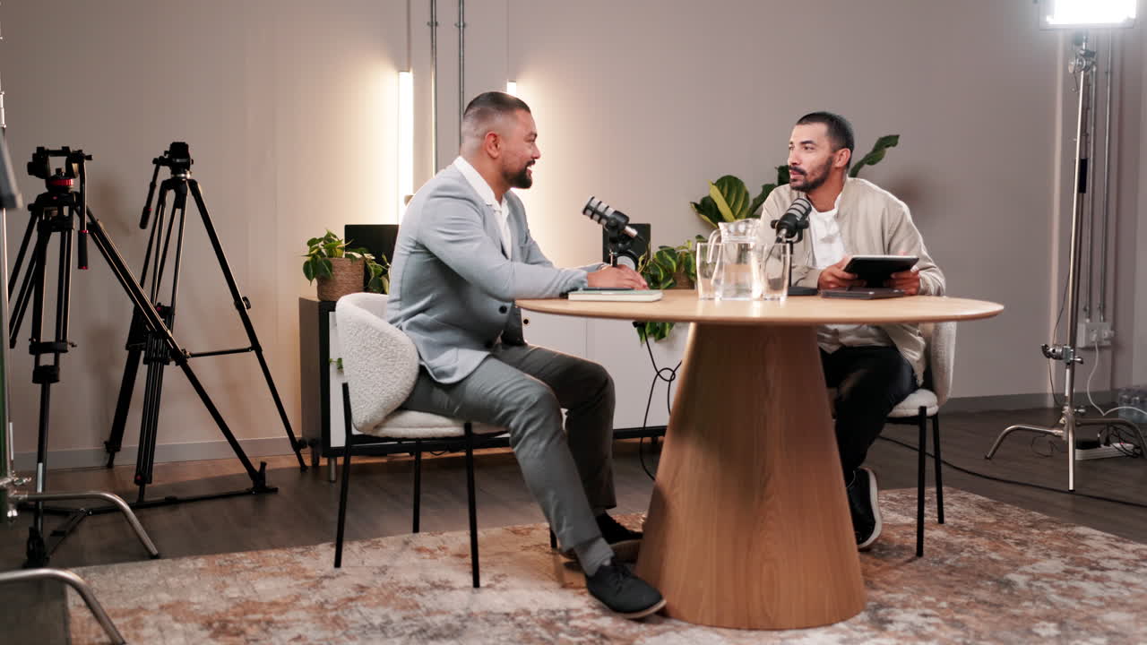 Two men recording a podcast in a studio