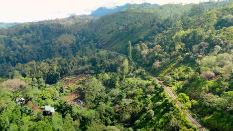 breathtaking aerial drone footage of a train crossing the iconic nine arches bridge in ella, sri lanka.