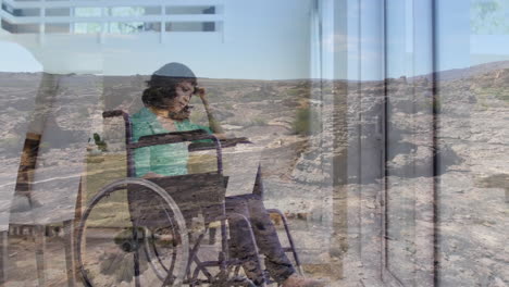 using laptop, woman in wheelchair viewing animation over rocky landscape background