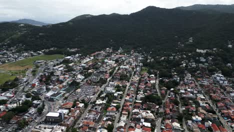 Lagoa-de-Conceicao-Town-in-Santa-Catarina-Brazil,-Mountain-Landscape-and-Neighborhood-Houses,-Florianopolis,-Travel-Destination,-Aerial-Panoramic-View