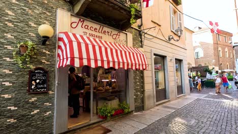 a bustling street with a quaint butcher shop