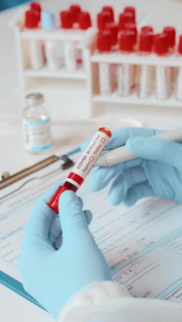 detailed blood test procedure in a clinical setting by a healthcare professional