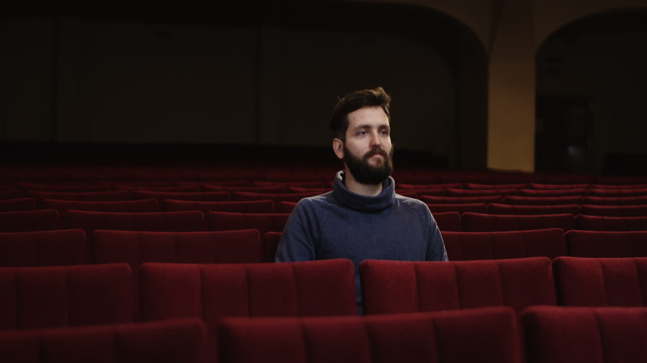Man watching a movie in a theater