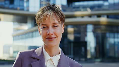 smiling business woman in city