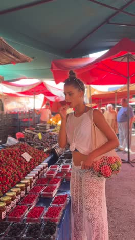 woman shopping for fruits at a market