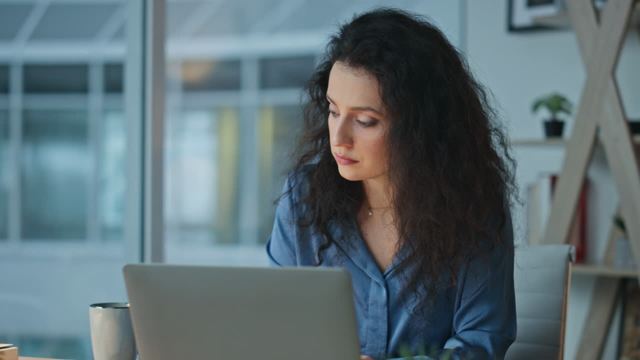 Corporate woman searching laptop information. Closeup focused ceo reading papers