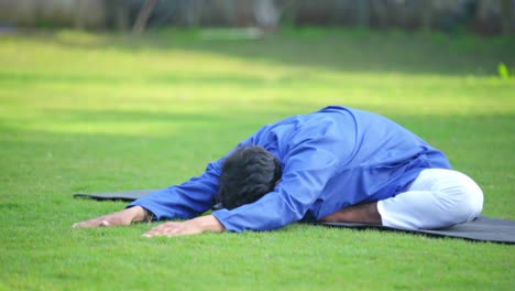 indian man performing advanced yoga