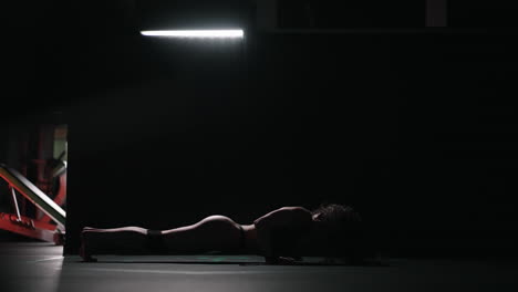 a young beautiful sexy woman dances beautifully in the gym. modern choreography in the gym. dancer