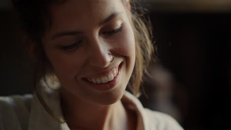 Dreamy-girl-smiling-indoors.-Positive-woman-making-something-in-workshop