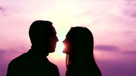 romantic silhouette of a couple at sunset