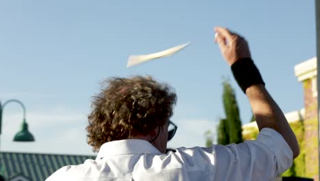 Back-View-Of-Male-Drummer-Losing-Stick-While-Doing-Tricks-At-The-Concert