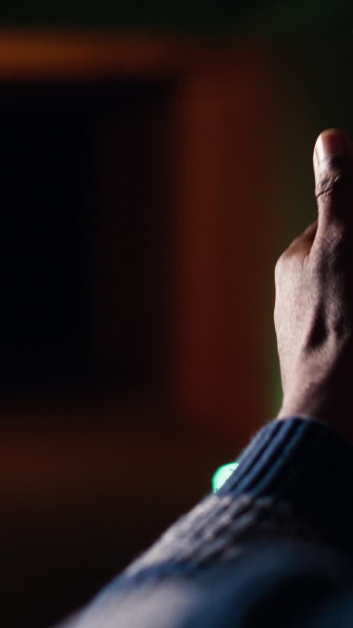 Vertical video Man at firing range location loading pistol with ammunition, close up