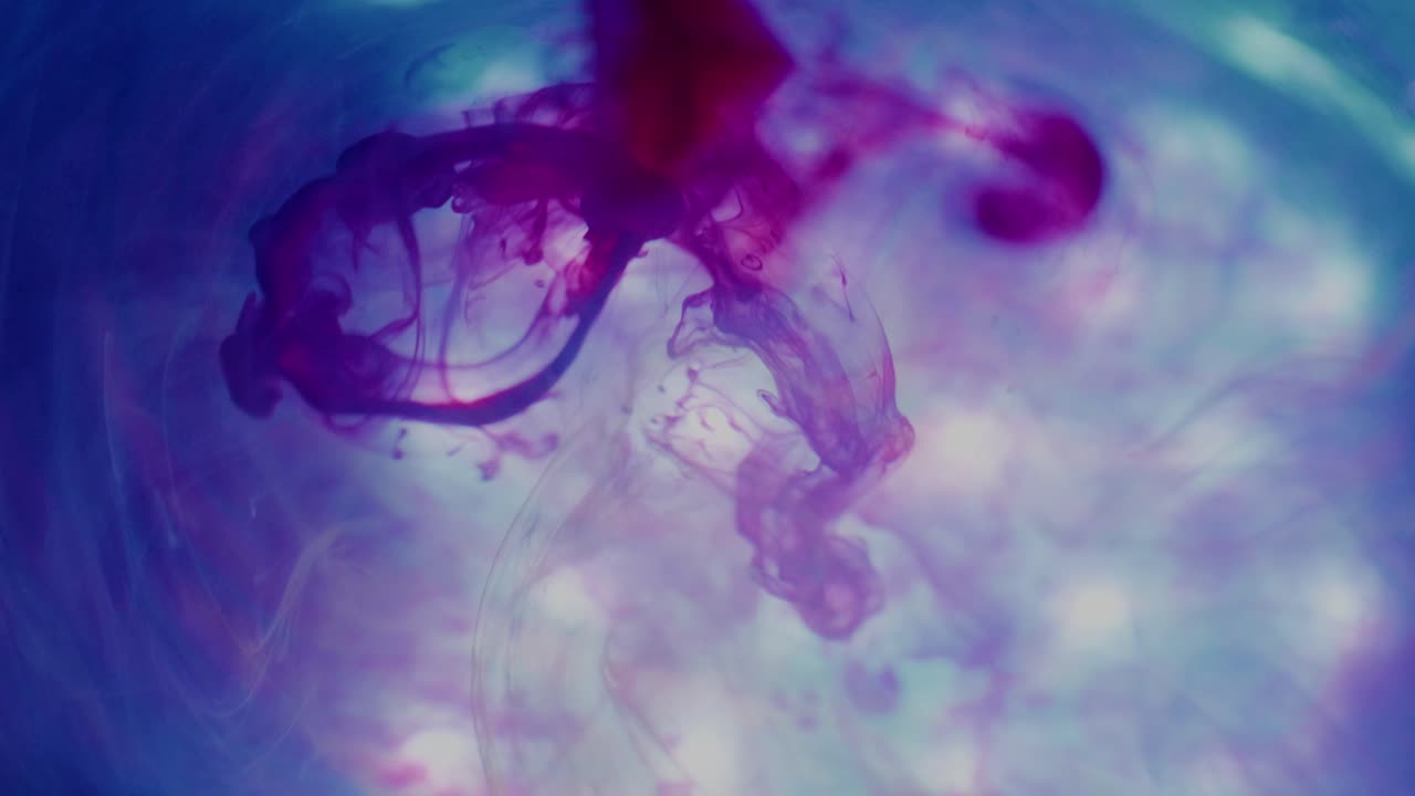 Footage of colored ink in water