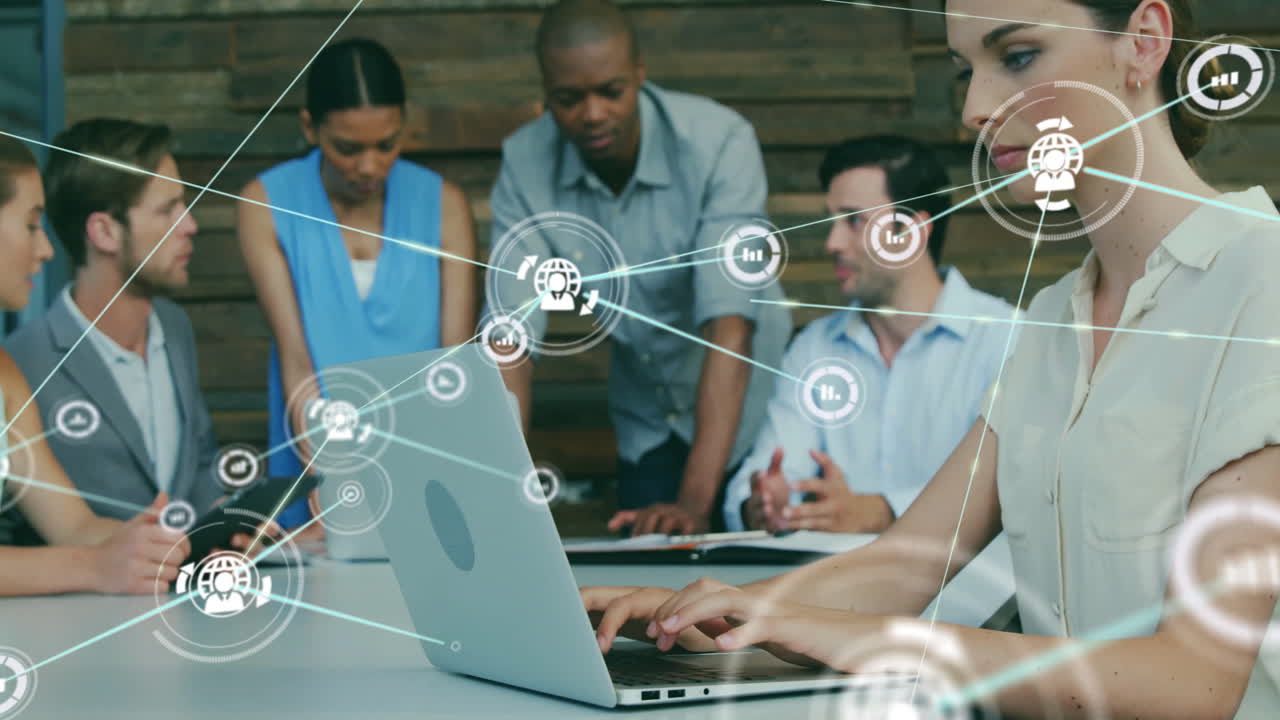 Animation of icons connected with lines over diverse coworkers discussing and preparing reports