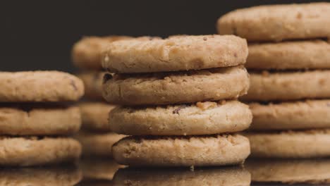 close up shot of piles of chocolate chip cookies rotating