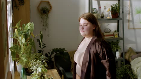 teenager looking at camera near the window