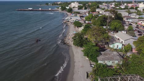 Caribbean-shoreline-flight-in-La-Ceiba,-Honduras-toward-tourist-pier