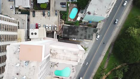 Hawaii-Aerial-Drone-View-over-building-roof-tops-and-Waikiki-Beach-in-Honolulu