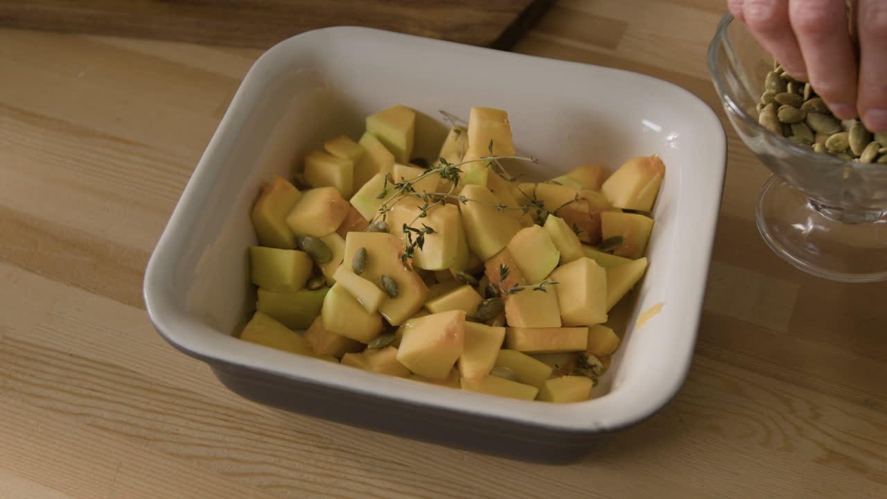 Preparing squash with pumpkin seeds and thyme