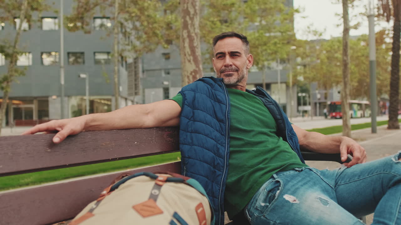 Man relaxing on a bench in the park