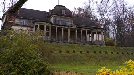 old and haunted manor building, low angle dolly in