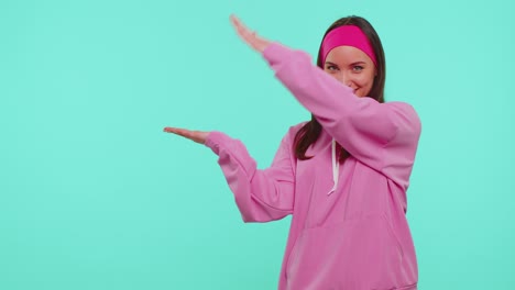 girl pointing empty place advertising area for commercial text copy space for goods promotion