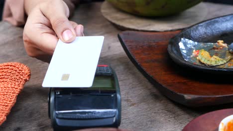 paying with credit card at a restaurant