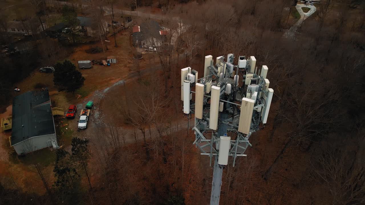 Aerial Shot Rotating Around Cell Phone Tower in Forest. 4K Drone
