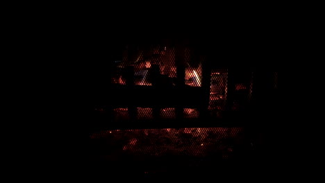 a small fireplace dies down as it dwindles to hot embers on a cold day in cognac, france