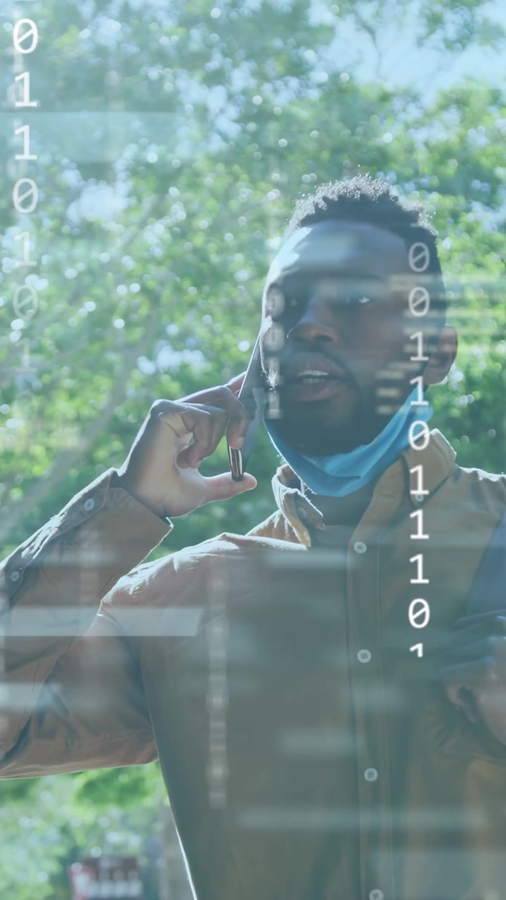 Vertical video: Man answering call, technology binary code columns rising over him