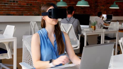 Female-executive-using-virtual-reality-headset